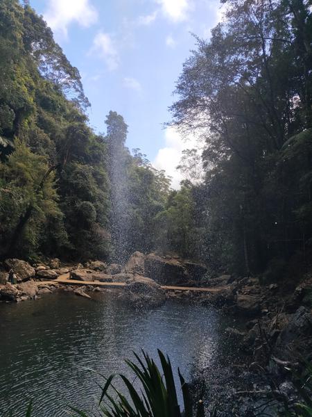 under a waterfall